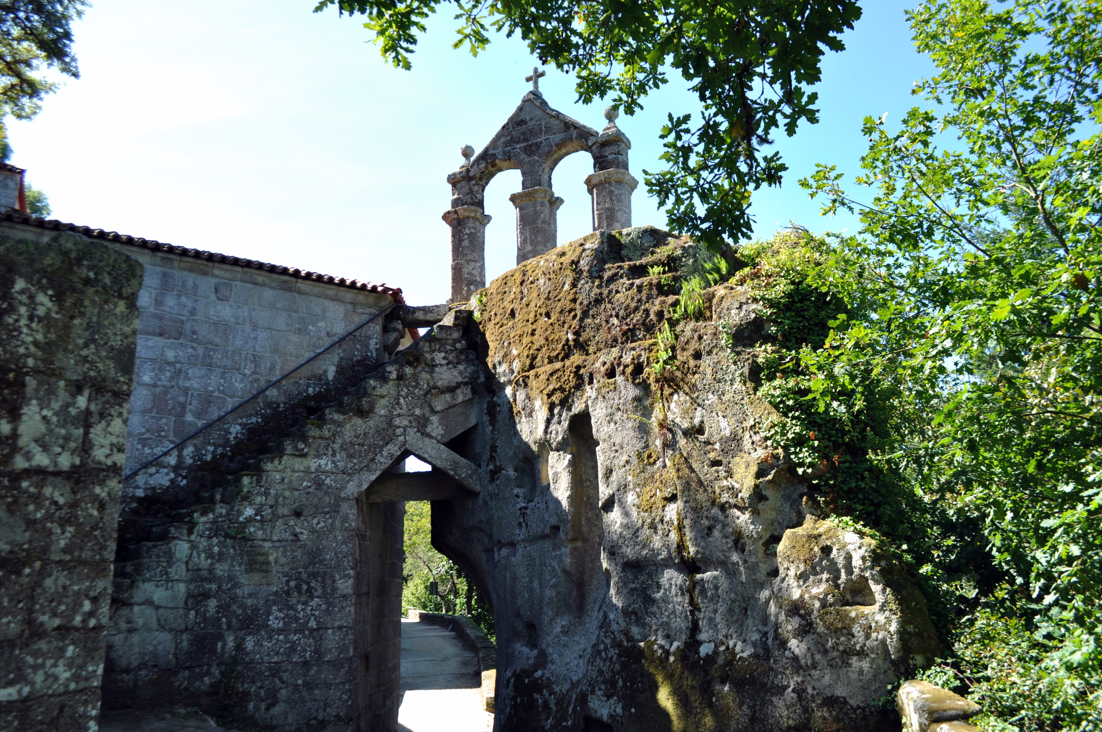 Bell gable rising from the stone at San Pedro de Rocas