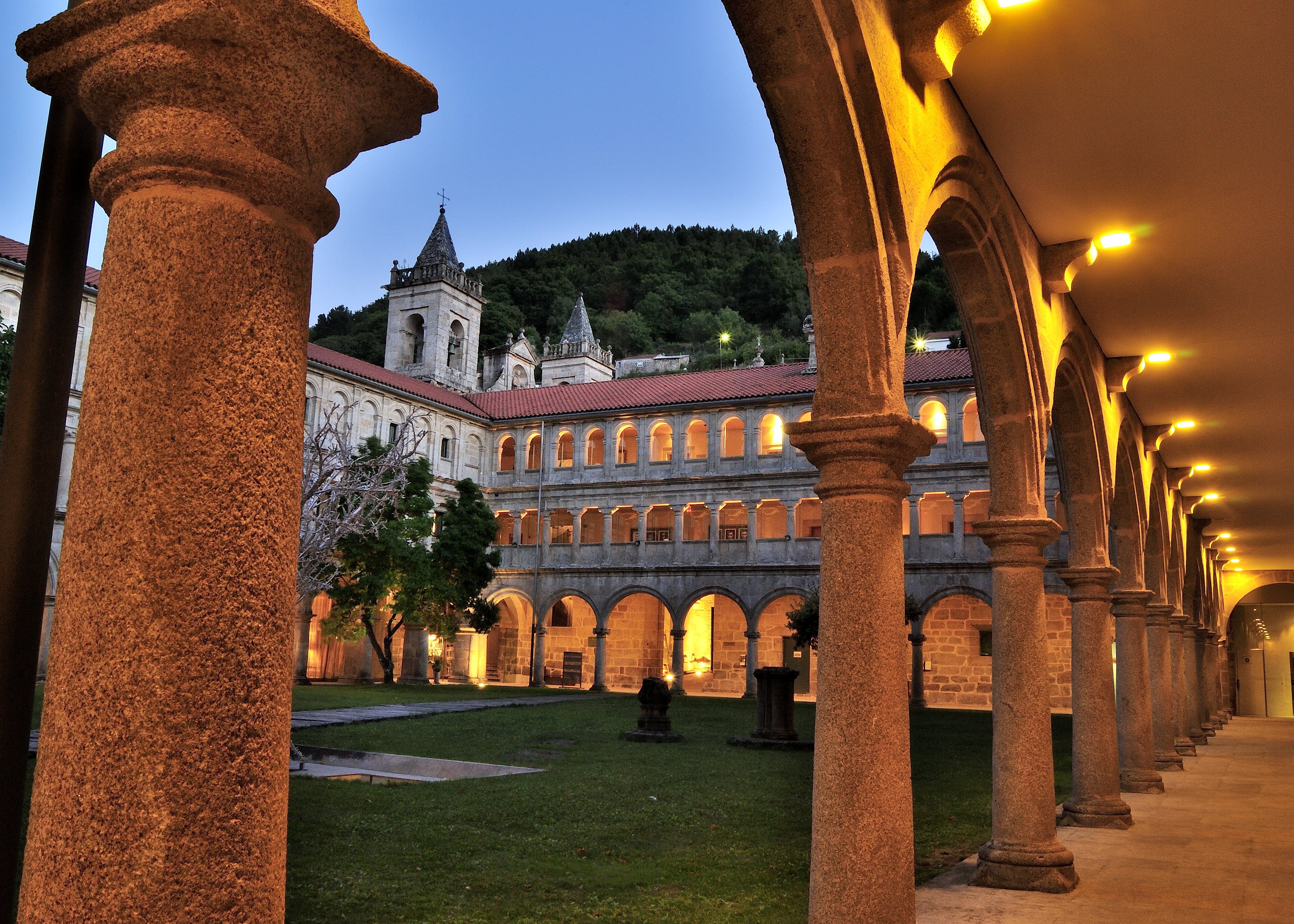 The historic cloister at Parador de Santo Estevo at dusk