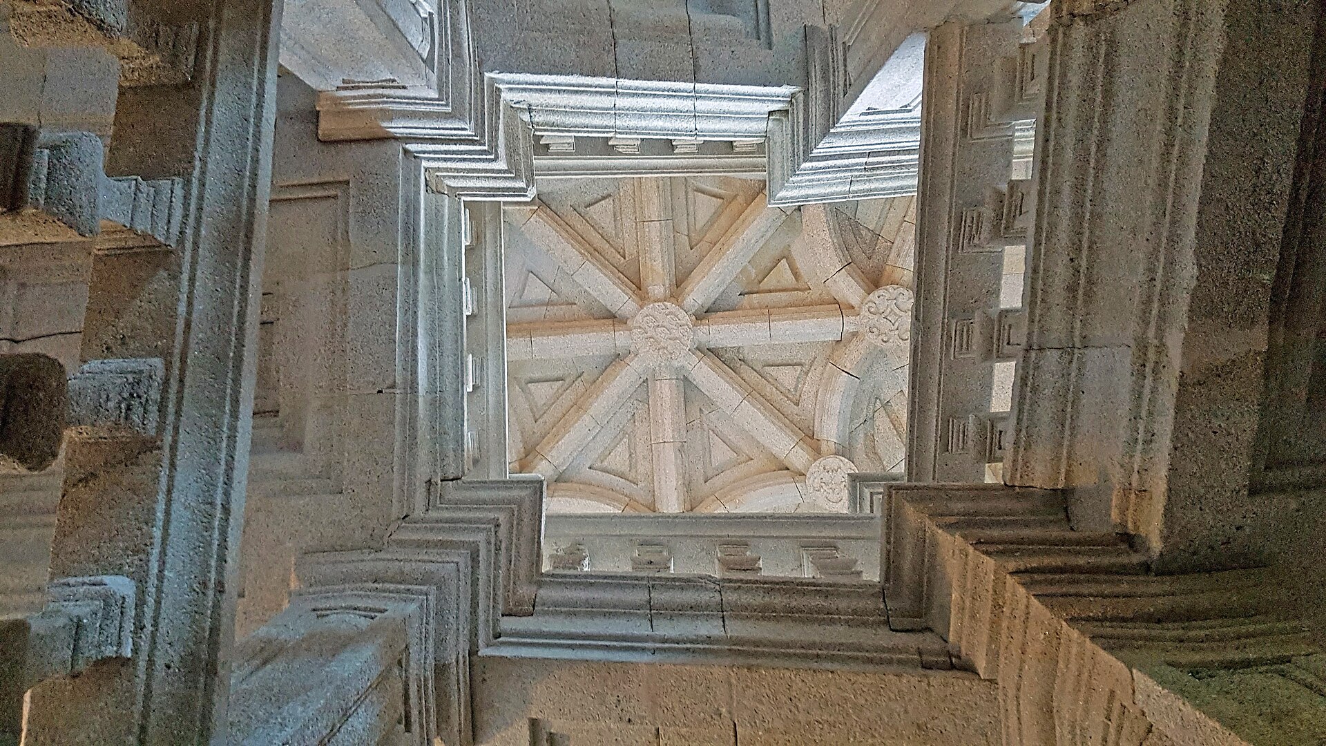 Looking upward through a historic stone stair